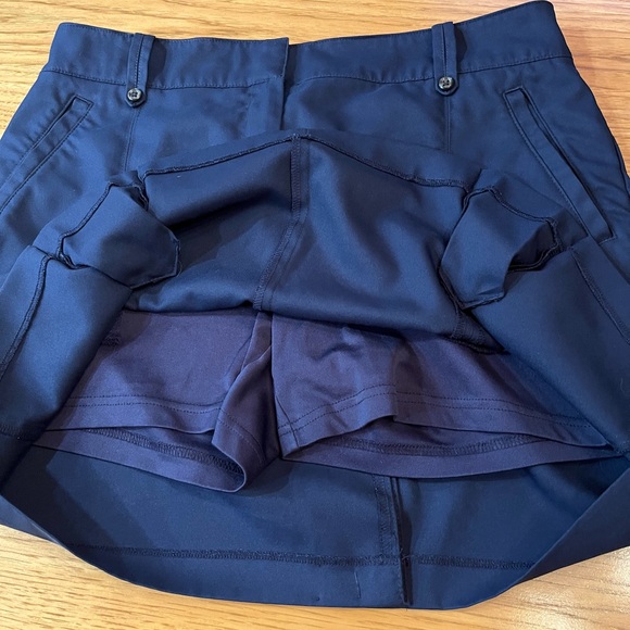 Izod Womens Skort Navy Blue Pockets Golf  Solid Zip Button Front Pleated Hem - Picture 7 of 9